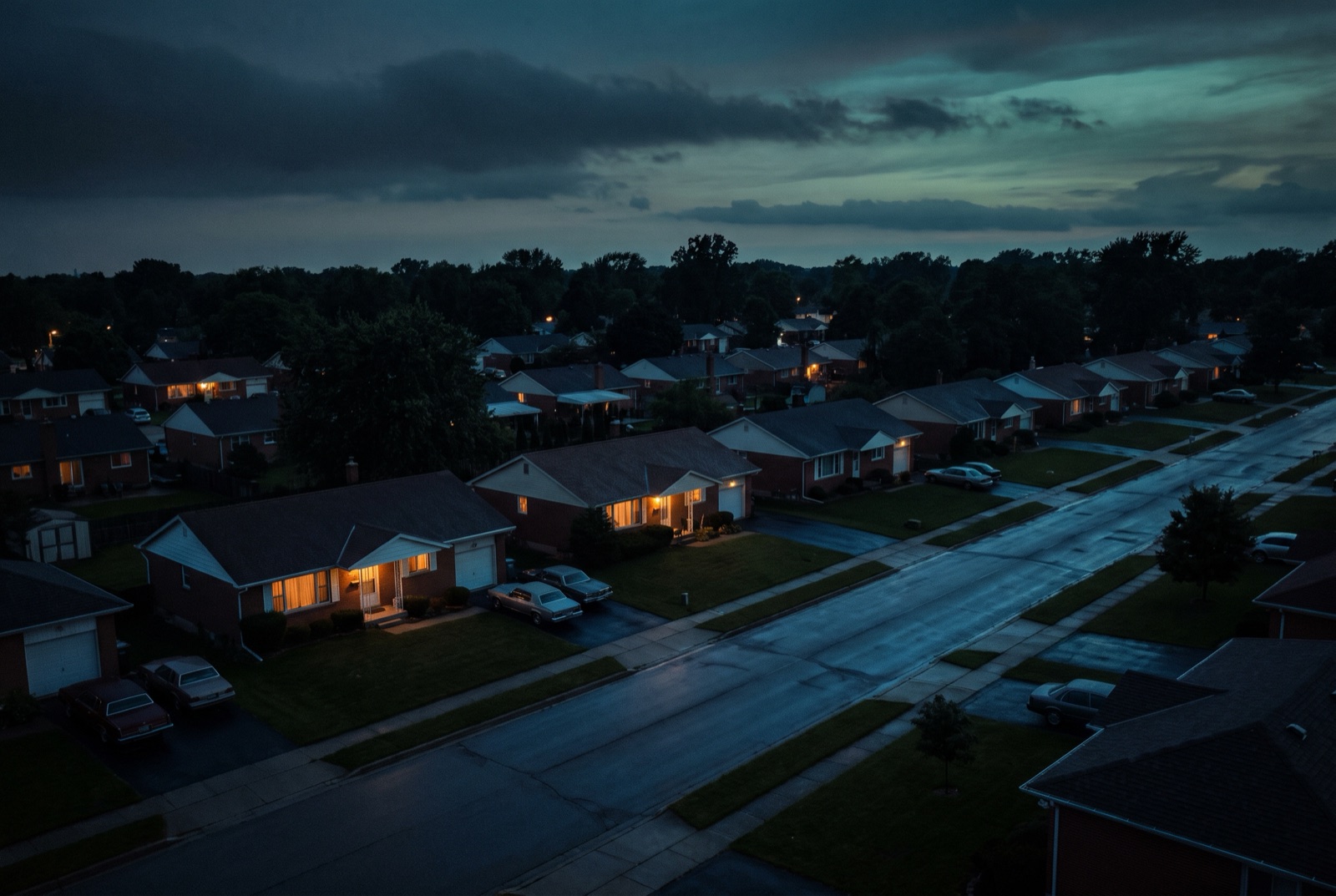 An ordinary American street at dusk, tens of millions of quiet homes